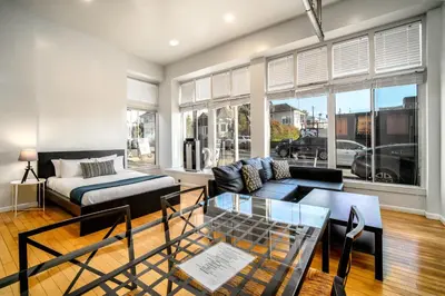 a living room with a couch and a bed at AIR Venice on the Beach in Los Angeles