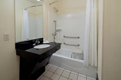 a bathroom with a sink and a tub and a toilet at Fairfield Inn & Suites - Los Angeles West Covina in West Covina