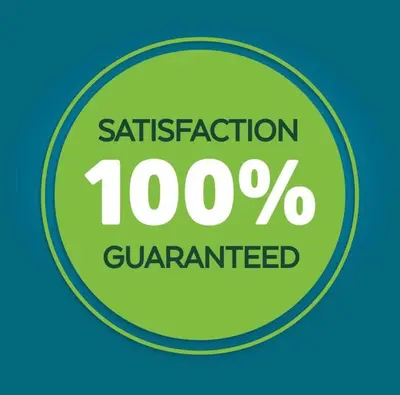a green sign with the words satisfaction percent guaranteed at Economy Inn Barstow in Barstow