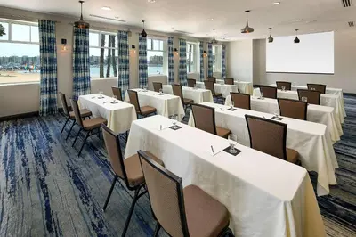 a dining room with white tables and chairs at Jamaica Bay Inn Marina Del Rey Tapestry Collection by Hilton in Los Angeles