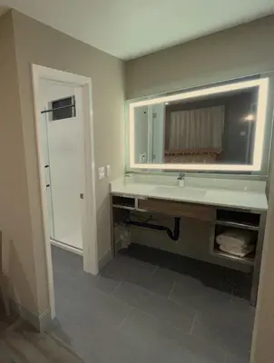a bathroom with a sink and a mirror at New Star Inn El Monte, CA - Los Angeles in El Monte