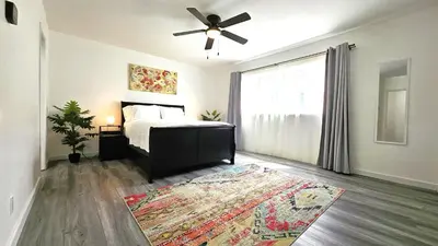 a bedroom with a bed and a ceiling fan at Double Suite Santa Monica - Free Parking in Santa Monica