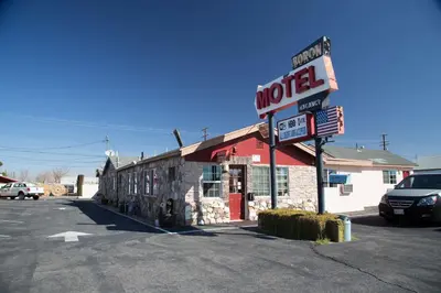 a motel sign on the side of a building at Boron Motel in Boron