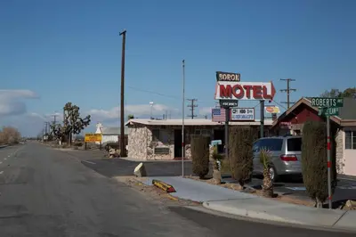 a motel sign on the side of a road at Boron Motel in Boron