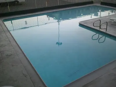 a swimming pool with a rope in the water at Little Boy Blue Motel in Anaheim