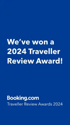 a blue sign that says weve won a traveler review award at Pacific Inn Anaheim in Anaheim