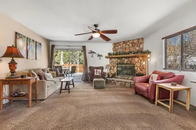 a living room with a couch and a fireplace at Piece of Paradise in Big Bear Lake