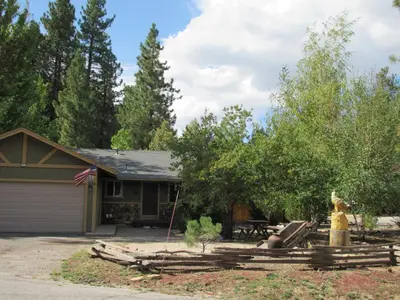 a house with a fire hydrant in the yard at Piece of Paradise in Big Bear Lake
