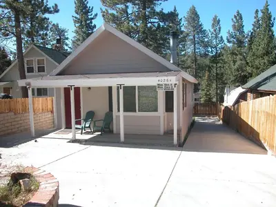 a small house with a porch and a deck at Big B's Den in Big Bear Lake