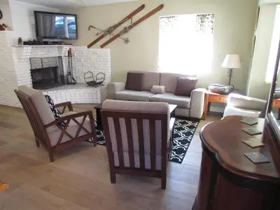 a living room with a couch and a fireplace at Big B's Den in Big Bear Lake