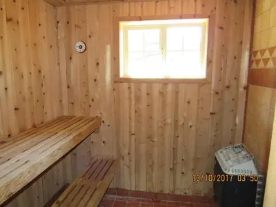 a wooden room with a sauna with a window at Summit Ski-Inn Ski-Out in Big Bear Lake