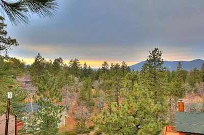 a view of a forest with mountains in the background at Summit Ski-Inn Ski-Out in Big Bear Lake