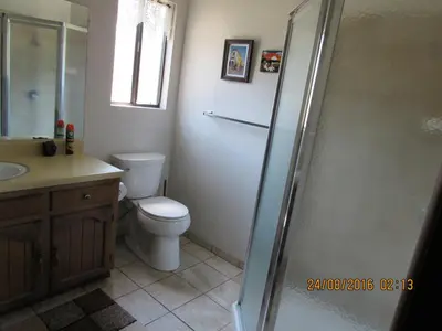 a bathroom with a toilet and a sink and a shower at Miller's Outpost in Big Bear Lake