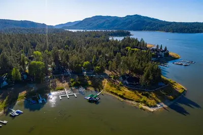 an aerial view of an island in the water at Lupine Lakeside Resort Cabin by Big Bear Vacations in Big Bear Lake