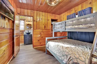 a bedroom with two bunk beds in a cabin at Lupine Lakeside Resort Cabin by Big Bear Vacations in Big Bear Lake