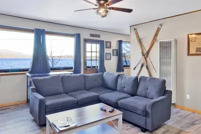 a living room with a couch and a table at Lakefront Family Cabin by Big Bear Vacations in Big Bear Lake