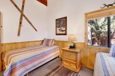 a bedroom with two beds and a window at Casa Catalina-667 by Big Bear Vacations in Big Bear Lake