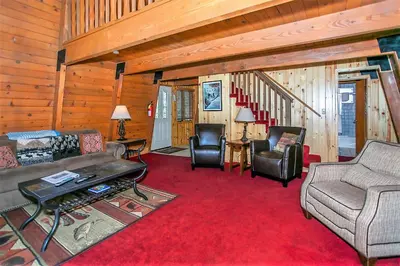 a living room with a couch and chairs and a table at Switzerland Ski Chalet-845 by Big Bear Vacations in Big Bear Lake