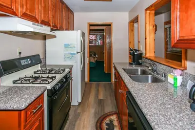 a kitchen with a stove and a sink at Avalon Hide Out-1336 by Big Bear Vacations in Big Bear Lake