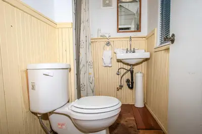 a small bathroom with a toilet and a sink at Pines 23-1438 by Big Bear Vacations in Big Bear Lake