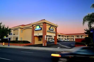 a hotel with a car parked in front of it at Days Inn by Wyndham Downey in Downey