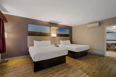 a hotel room with two beds and a window at Best Western Diamond Bar Hotel & Suites in Diamond Bar