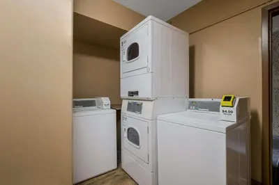 a laundry room with washers and dryers in a room at Best Western Diamond Bar Hotel & Suites in Diamond Bar