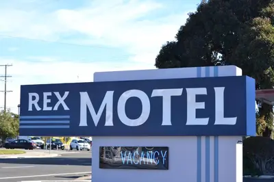 a sign that reads rex motel on a street at Rex Motel in Ventura