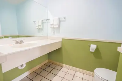 a bathroom with a sink and a toilet at Day & Night Inn in Hesperia