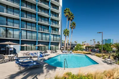a swimming pool in front of a building at Holiday Inn Express & Suites Santa Ana - Orange County by IHG in Santa Ana