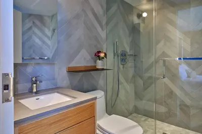 a bathroom with a shower and a toilet and a sink at Mayumi in Los Angeles