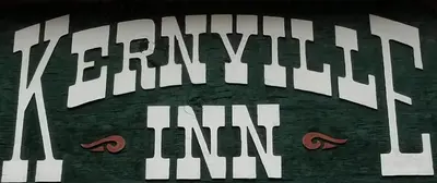 a close up of a clock with two pairs of shoes at Kernville Inn in Kernville
