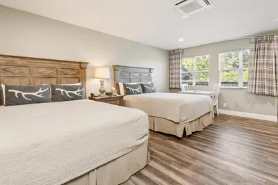 a bedroom with two beds and a window at Big Bear Frontier in Big Bear Lake