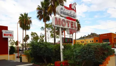 a motel sign on the side of a street at Motel 6 Glendale CA Pasadena Burbank Los Angeles in Glendale