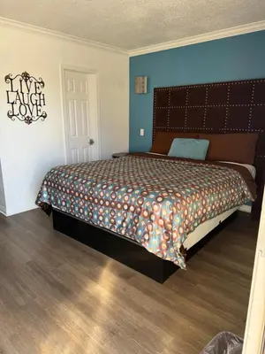 a bedroom with a large bed in a room at El Dorado Motel in Gardena