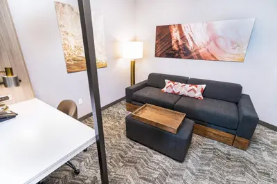 a living room with a couch and a table at SpringHill Suites by Marriott Ontario Airport/Rancho Cucamonga in Ontario