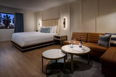 a hotel room with a bed and a couch at The Anza-a Calabasas Hotel in Calabasas