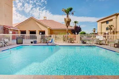 a swimming pool in front of a house at Homewood Suites Lancaster in Lancaster
