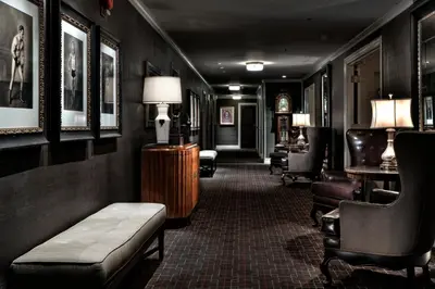 a hallway with a couch and chairs in a room at Los Angeles Athletic Club in Los Angeles