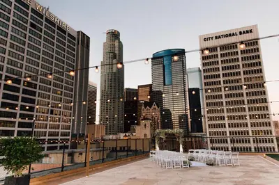 a view of a city skyline with white tables and buildings at Los Angeles Athletic Club in Los Angeles