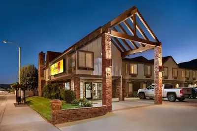 a building with a sign in front of it at Super 8 by Wyndham Santa Clarita/Valencia in Santa Clarita