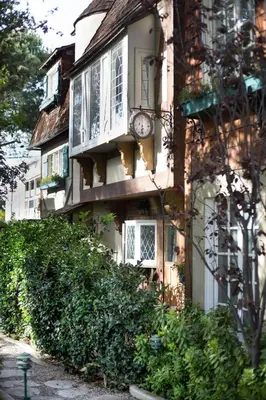 a building with a clock on the side of it at The Charlie West Hollywood in Los Angeles