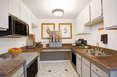 a kitchen with a sink and a counter top at Howard Johnson by Wyndham Torrance in Torrance