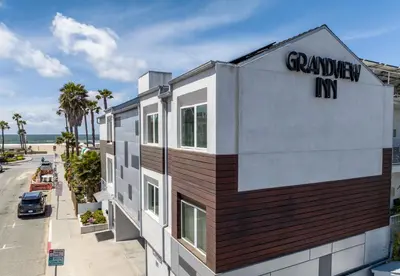 a building with a sign on the side of it at Grandview Inn in Hermosa Beach