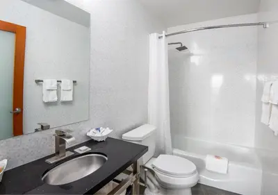 a bathroom with a sink and a toilet and a shower at Grandview Inn in Hermosa Beach
