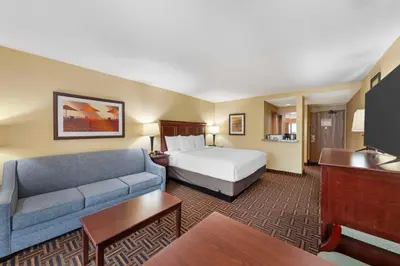 a hotel room with a bed and a couch at Best Western Plus Redondo Beach Inn in Redondo Beach