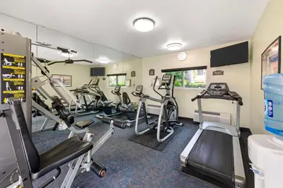 a gym with several treadmills and elliptical machines at Best Western Plus Redondo Beach Inn in Redondo Beach