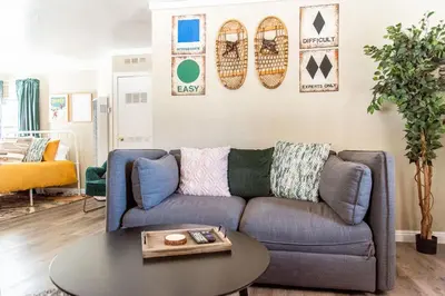 a living room with a couch and a table at Lakewood Cabins in Big Bear Lake
