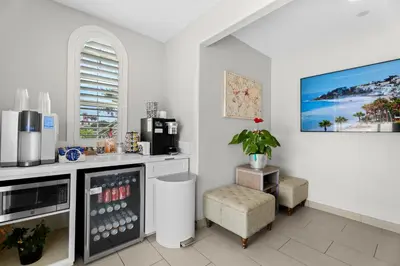 a kitchen with a refrigerator and a chair in it at Ocean Park Inn in Los Angeles