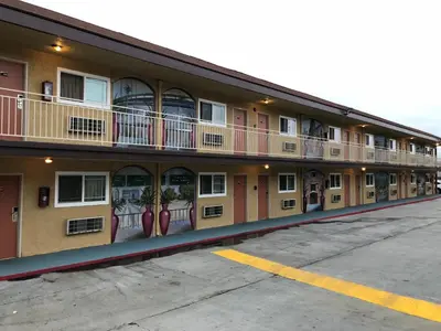 a building with windows and balconies on the side of it at Los Angeles Inn & Suites - LAX in Los Angeles